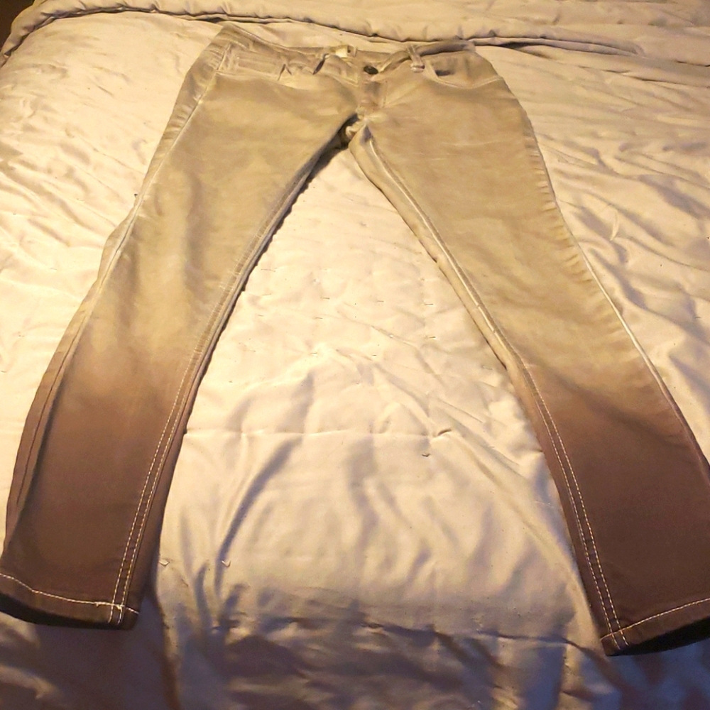 Mid-rise tan skinny jeans